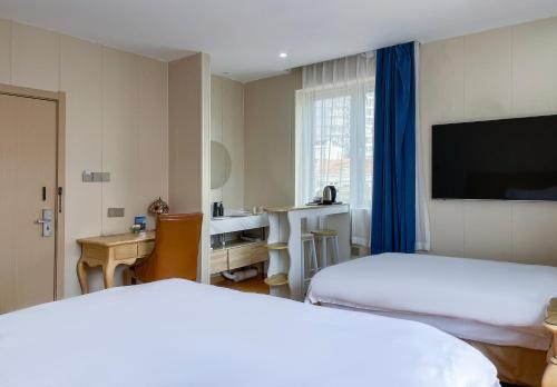Imagen de la habitación del Hotel Qingdao Liuying Jieli - Qingdao Station Trestle Bridge Branch. Foto 15