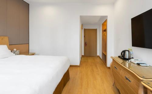 Imagen de la habitación del Hotel Qingdao Liuying Jieli - Qingdao Station Trestle Bridge Branch. Foto 16