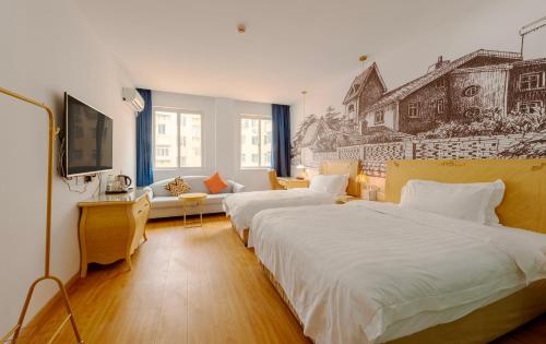 Imagen de la habitación del Hotel Qingdao Liuying Jieli - Qingdao Station Trestle Bridge Branch. Foto 18