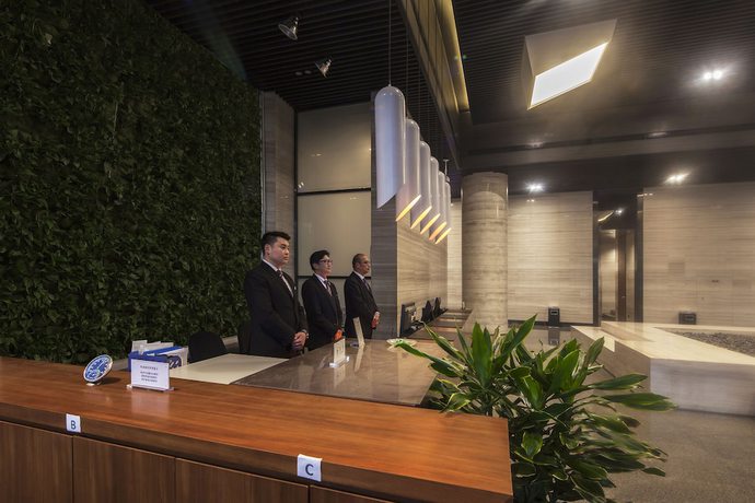Imagen de los interiores del Hotel Qingdao Majesty Mansion. Foto 19