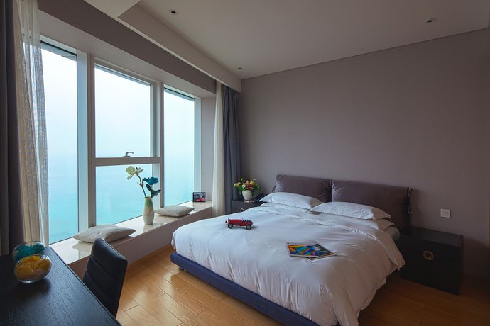 Imagen de la habitación del Hotel Qingdao Majesty Mansion. Foto 9