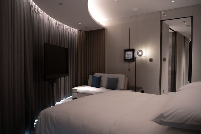 Imagen de la habitación del Hotel Qingdao Marriott Jiaozhou. Foto 13