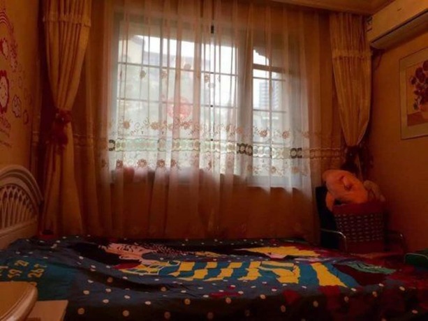 Imagen de la habitación del Hotel Qingdao Seaside Resort Apartment. Foto 7