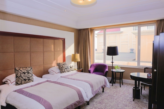 Imagen de la habitación del Hotel Qingdao Seaview Garden. Foto 4