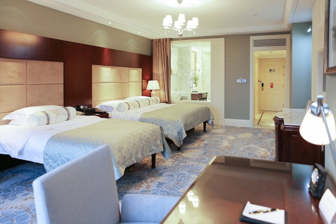 Imagen de la habitación del Hotel Qingdao Seaview Garden. Foto 8