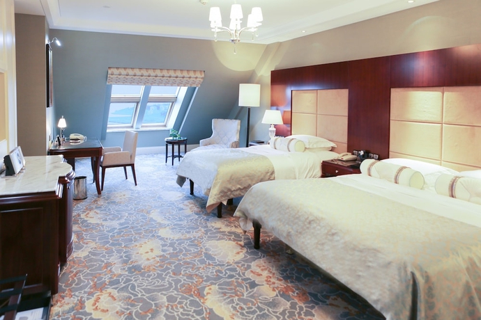 Imagen de la habitación del Hotel Qingdao Seaview Garden. Foto 9
