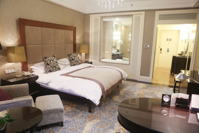 Imagen de la habitación del Hotel Qingdao Seaview Garden. Foto 16