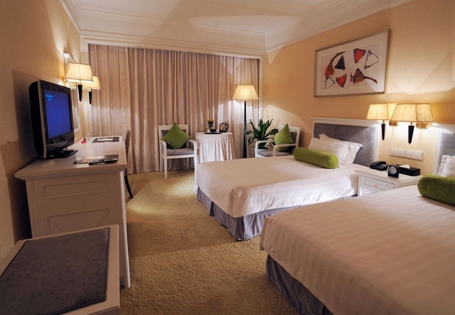 Imagen de la habitación del Hotel Qingdao The Castle. Foto 4