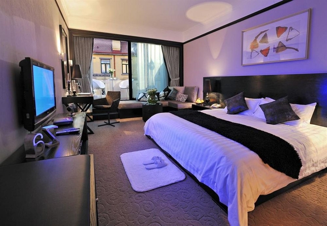 Imagen de la habitación del Hotel Qingdao The Castle. Foto 5