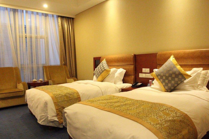 Imagen de la habitación del Hotel Qingdao Tianrunjinwang. Foto 6