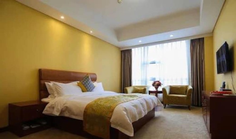 Imagen de la habitación del Hotel Qingdao Tianrunjinwang. Foto 9
