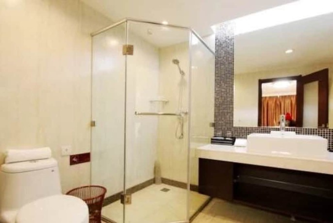 Imagen de la habitación del Hotel Qingdao Tianrunjinwang. Foto 10
