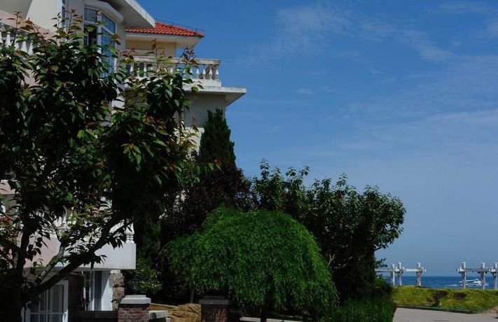 Imagen de los exteriores del Hotel Qingdao Villa Inn Seaside. Foto 11
