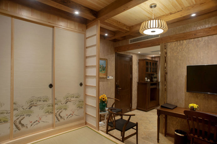 Imagen de la habitación del Hotel Qingdao Villa Inn Seaside. Foto 4