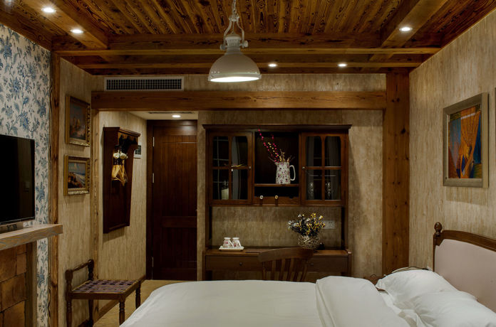Imagen de la habitación del Hotel Qingdao Villa Inn Seaside. Foto 5