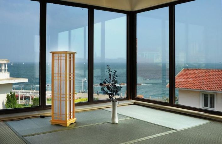 Imagen de la habitación del Hotel Qingdao Villa Inn Seaside. Foto 8