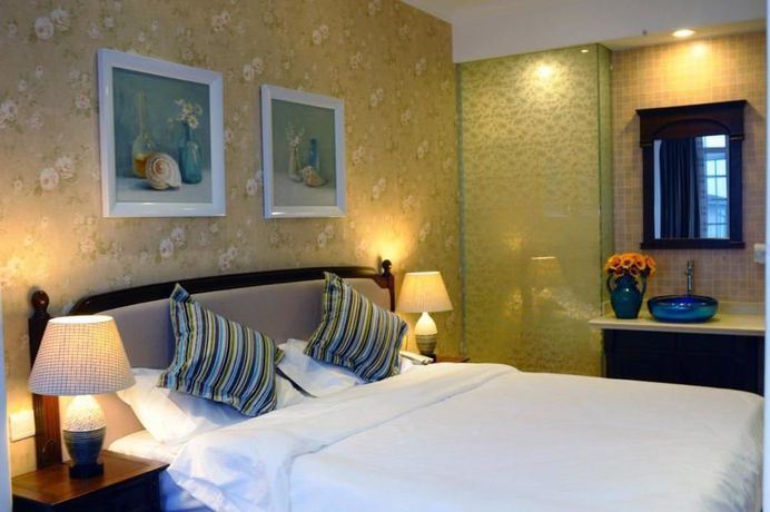 Imagen de la habitación del Hotel Qingdao Villa Inn Seaside. Foto 9