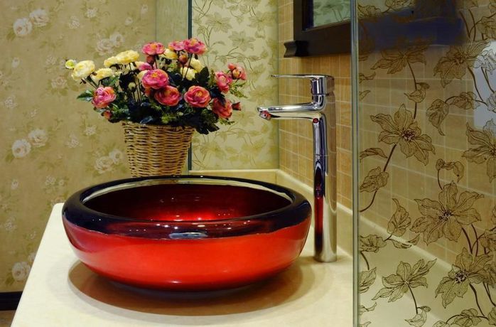 Imagen de la habitación del Hotel Qingdao Villa Inn Seaside. Foto 10