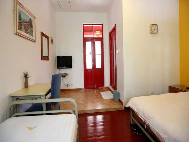 Imagen de la habitación del Hotel Qingdao Wheat Youth Hostel. Foto 10