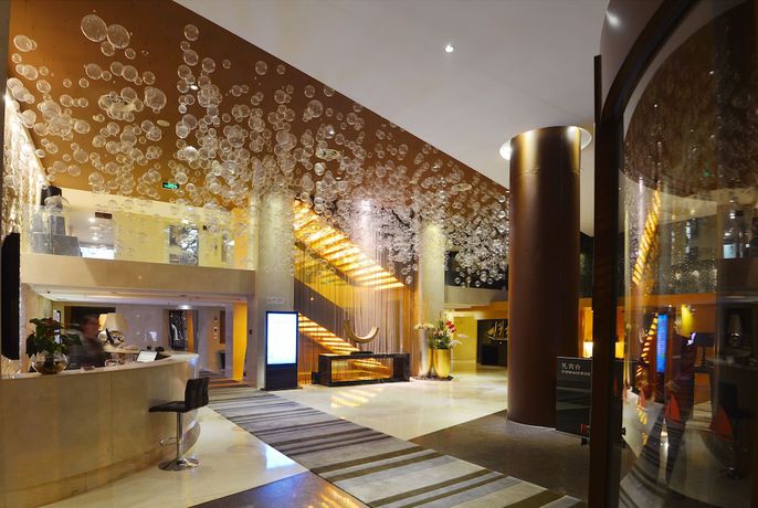 Imagen de los interiores del Hotel Qingdao Wushengguan Holiday. Foto 20