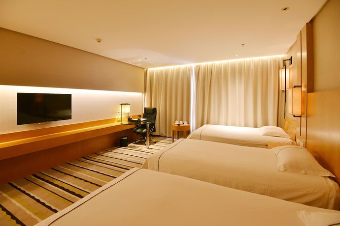 Imagen de la habitación del Hotel Qingdao Wushengguan Holiday. Foto 6