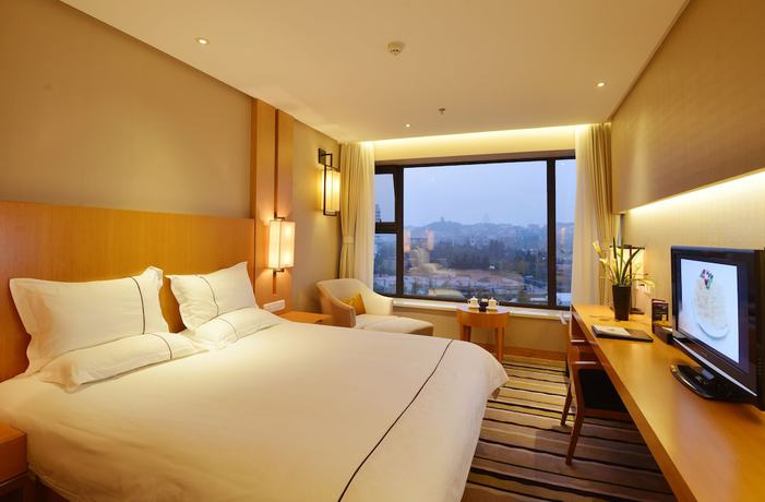 Imagen de la habitación del Hotel Qingdao Wushengguan Holiday. Foto 7