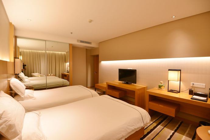 Imagen de la habitación del Hotel Qingdao Wushengguan Holiday. Foto 10