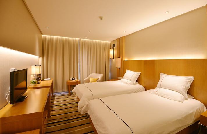 Imagen de la habitación del Hotel Qingdao Wushengguan Holiday. Foto 14