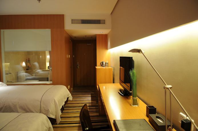 Imagen de la habitación del Hotel Qingdao Wushengguan Holiday. Foto 15