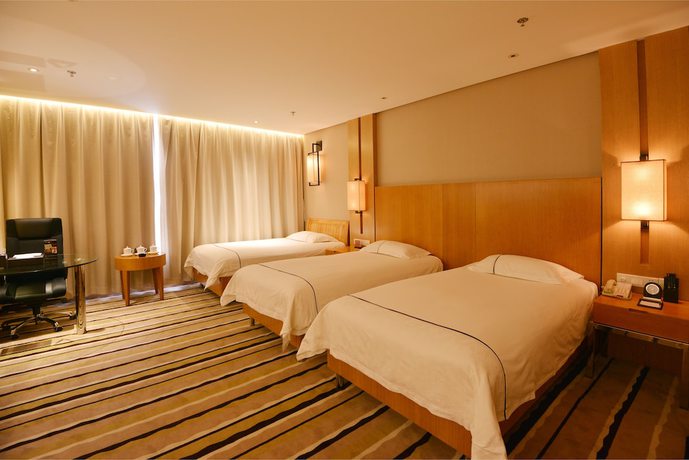 Imagen de la habitación del Hotel Qingdao Wushengguan Holiday. Foto 16
