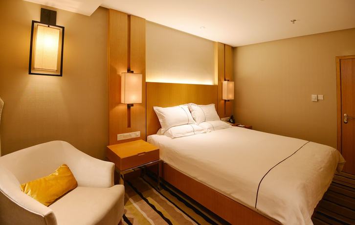 Imagen de la habitación del Hotel Qingdao Wushengguan Holiday. Foto 18
