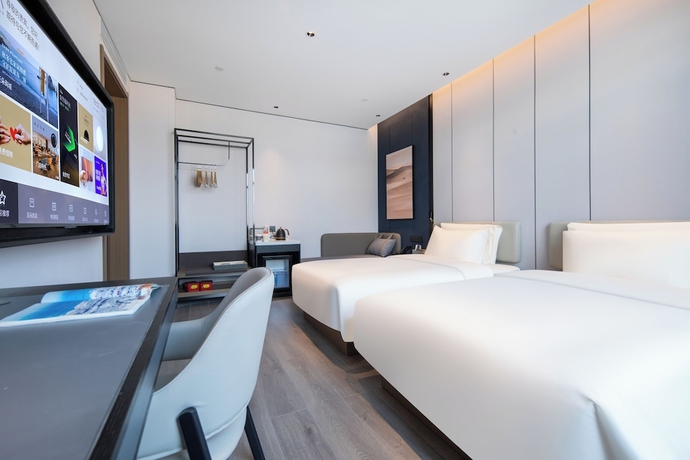 Imagen de la habitación del Hotel QingdaoWusiguangchangYaduoJiudian. Foto 4