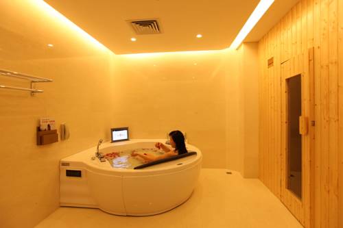 Imagen de la habitación del Hotel Qinghe Jin Jiang International. Foto 4