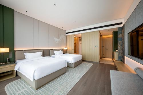 Imagen general del Hotel Qinglian Jinghe Wuhan Zoo International Expo Center Branch. Foto 3