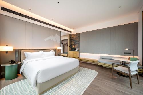 Imagen general del Hotel Qinglian Jinghe Wuhan Zoo International Expo Center Branch. Foto 6