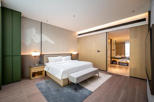 Imagen de la habitación del Hotel Qinglian Jinghe Wuhan Zoo International Expo Center Branch. Foto 19