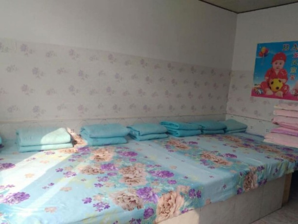 Imagen de la habitación del Hotel Qinglongxia Pinfu Scenic Farm Stay. Foto 11