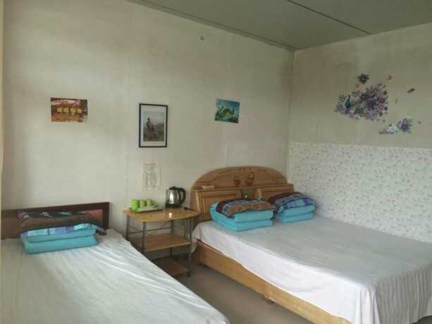 Imagen de la habitación del Hotel Qinglongxia Pinfu Scenic Farm Stay. Foto 12