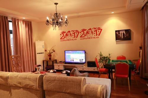 Imagen de la habitación del Hotel Qingyuan Meilin Lake Travel Holiday Villa. Foto 9
