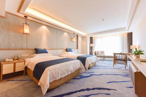 Imagen de la habitación del Hotel Qinhuangdao Btg Jinglun. Foto 8