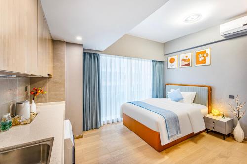 Imagen de la habitación del Hotel Qinman - Gongbei Port Fuhuari Branch. Foto 13
