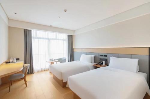 Imagen de la habitación del Hotel Qinman - Gongbei Port Fuhuari Branch. Foto 16