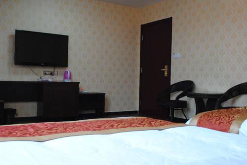 Imagen de la habitación del Hotel Qintian Business. Foto 6