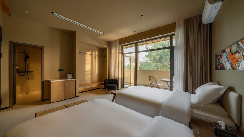 Imagen de la habitación del Hotel Qinxiang Pavilion. Foto 11
