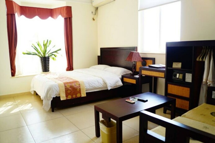 Imagen de la habitación del Hotel Qionghai Zhushan Tianlaiquan Apartment. Foto 14