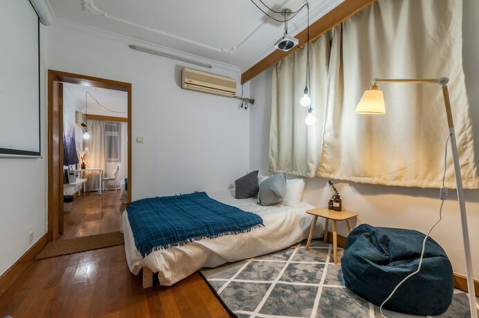 Imagen de la habitación del Hotel Qiyu Homestay - West Nanjing Road Branch. Foto 13