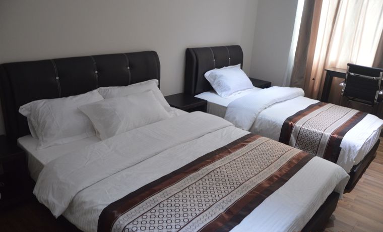 Imagen de la habitación del Hotel Qu Lin Resident. Foto 13