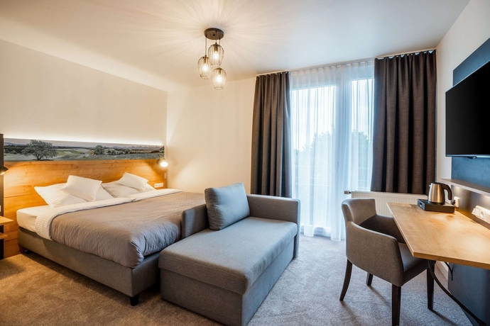 Imagen de la habitación del Hotel Quality and Suites Muenchen Messe. Foto 7