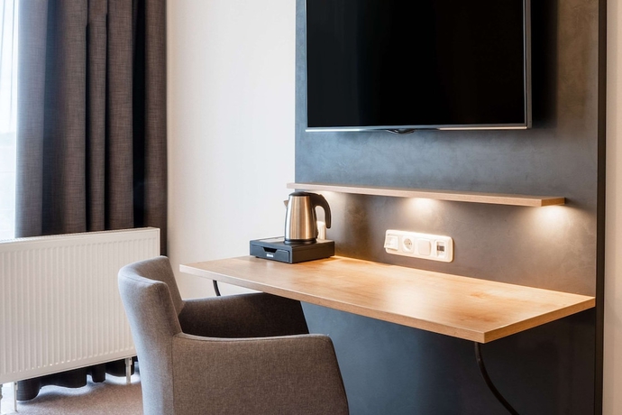 Imagen de la habitación del Hotel Quality and Suites Muenchen Messe. Foto 11