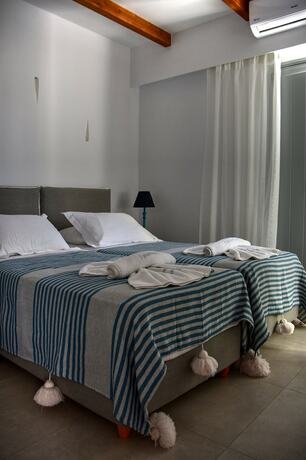 Imagen de la habitación del Hotel Quartano Luxury Cycladic Residence. Foto 14